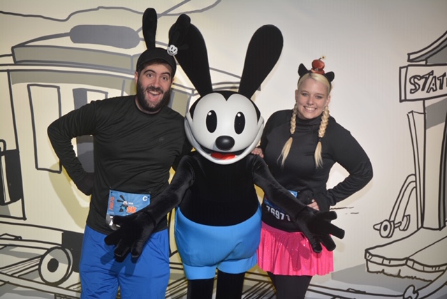 Katie and Spencer meet Oswald the Lucky Rabbit while dressed as Oswald and Ortensia.