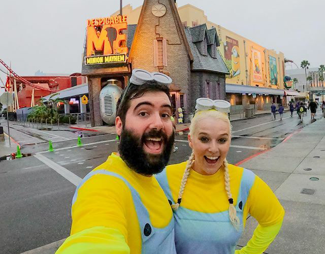 Katie & Spencer dressed as Minions in front of Despicable Me ride at Universal Orlando